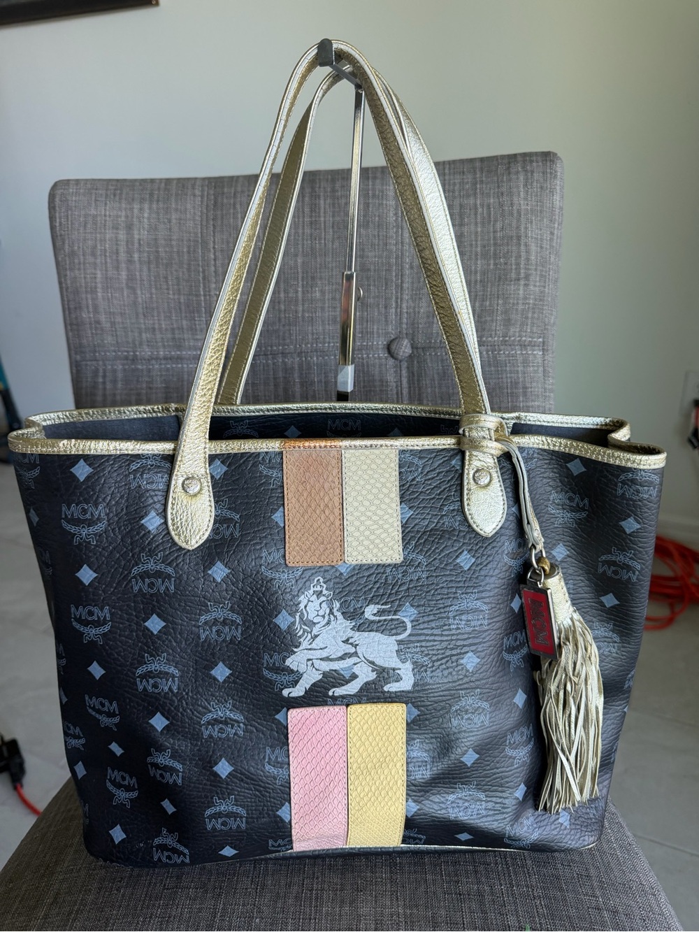MCM Black Logo Tote with Gold Trim and Multicolor Stripe Accents